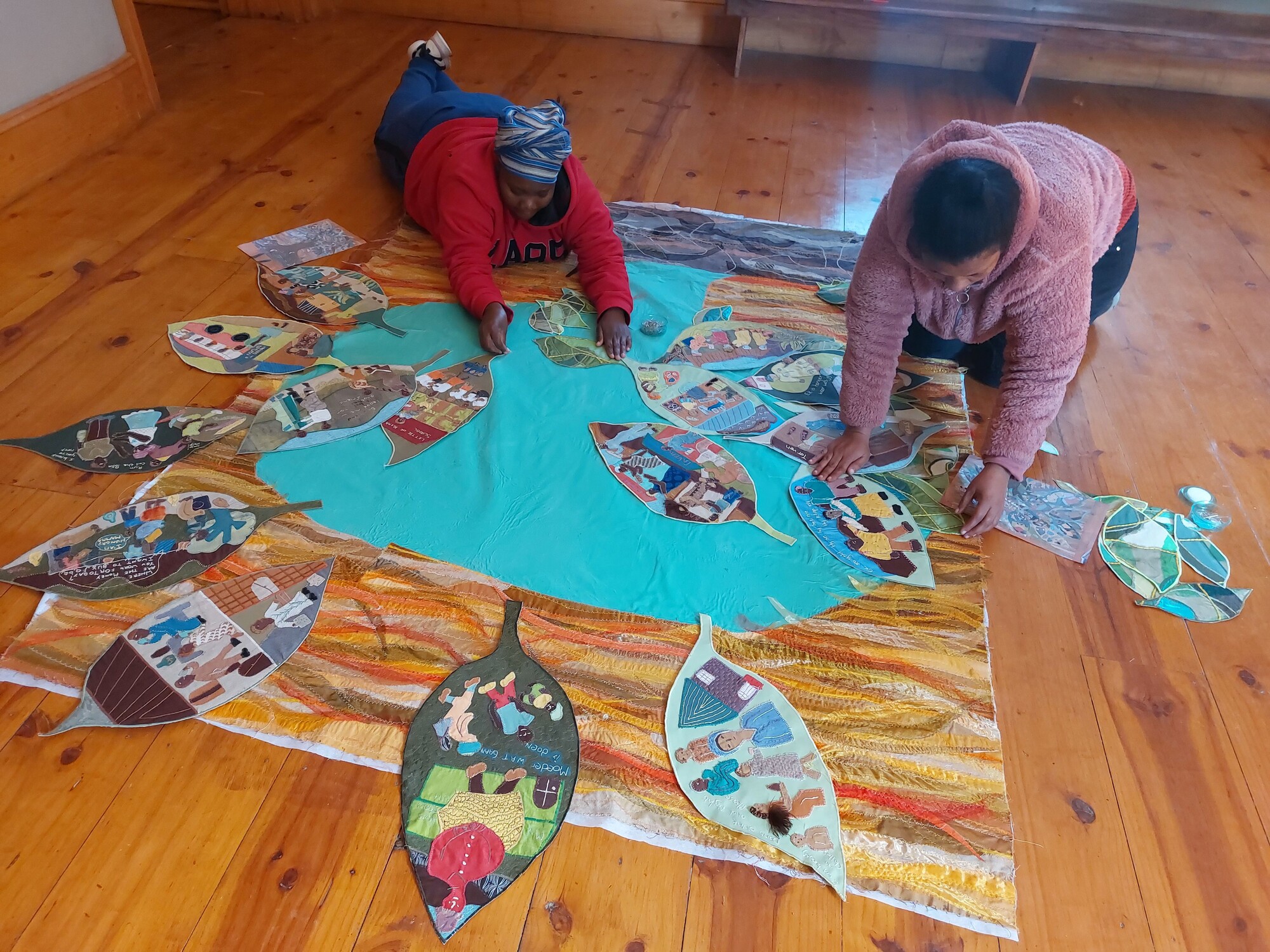 11 20230629 140339 Restorations in progress Felicty and Sandra placing leaves